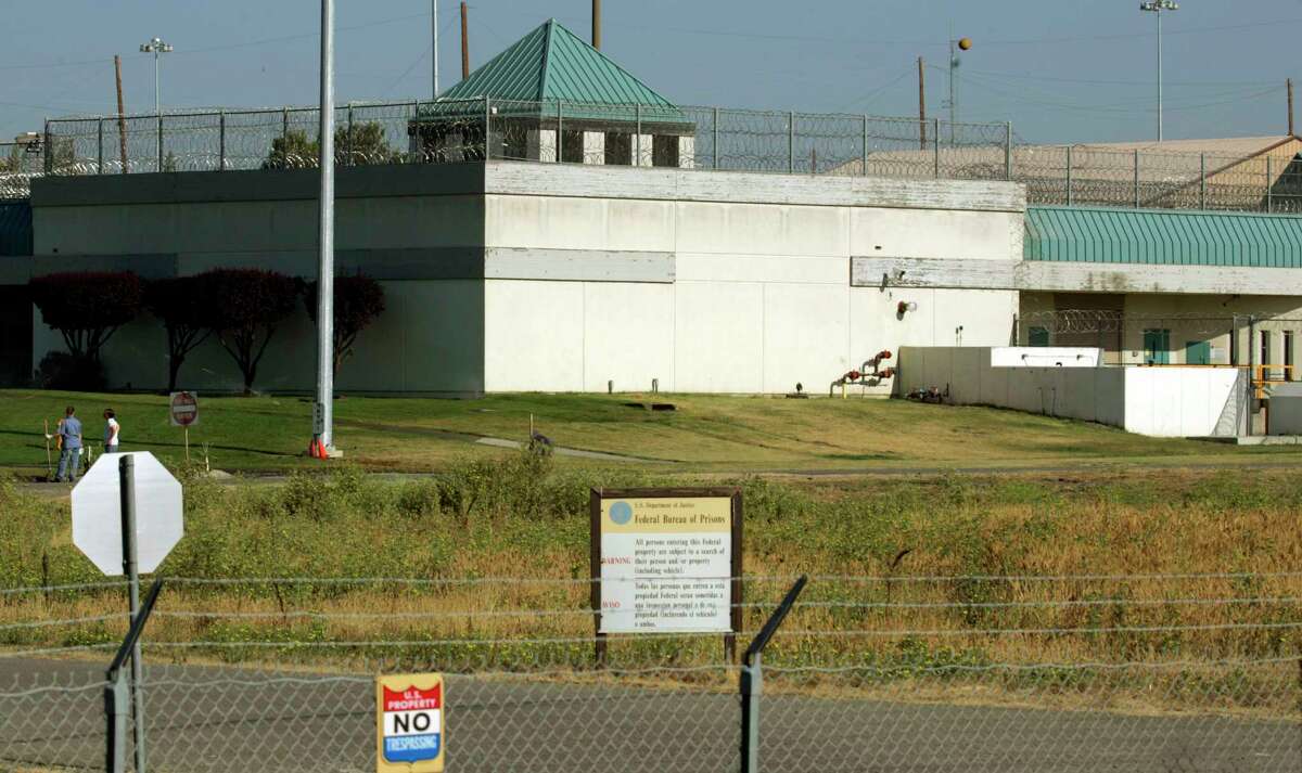 A former guard at the federal women's prison in Dublin was sentenced Thursday to 20 months in prison for groping an inmate at the troubled institution.