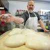 Leigh Rathner works dough at his bakery, Night Work Bread, on Thursday, Feb. 9, 2023. The bakery recently opened on Science Street in Ballston Spa, NY.