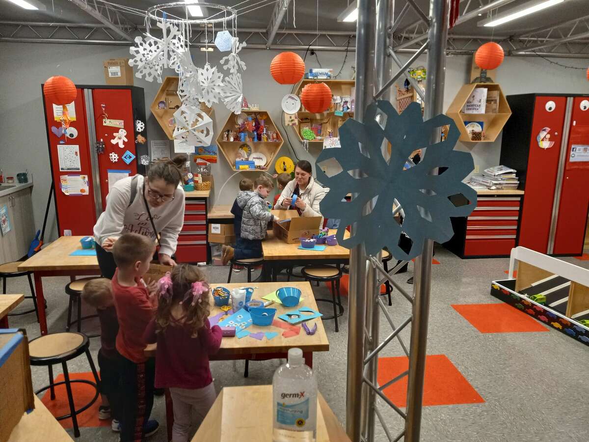 KidsPlay Children's Museum held a Winterpalooza party and ribbon-cutting for its Polar Pond, a special sliding pond with penguins, a polar bear and a seal to play with. The museum's maker space is a popular spot for children. 