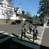 Pedestrians cross New Lebanon Ave along  Delavan Ave in Greenwich, Conn., on Friday February 10, 2023. The town is looking at putting new crosswalks across  Delavan Ave at the intersection with Chestnut and New Lebanon.