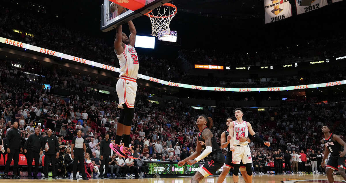 Jimmy Butler #22 of the Miami Heat catches an alley-oop with .7 seconds left on the clock in the fourth quarter against the Houston Rockets at Miami-Dade Arena on February 10, 2023 in Miami, Florida. (Photo by Eric Espada/Getty Images)