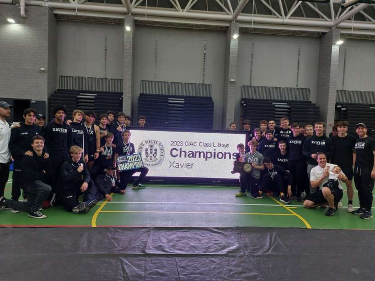 Xavier celebrates winning its second straight CIAC Class L Boys Indoor Track Championship team title with 74 points.