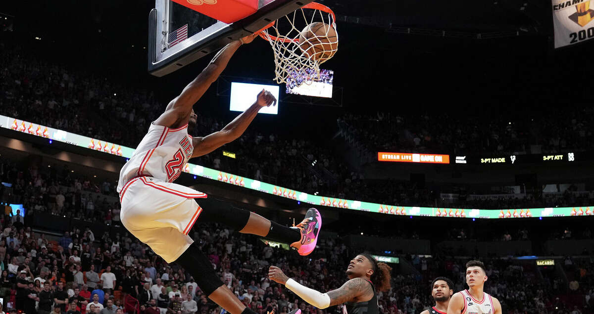 Jimmy Butler #22 of the Miami Heat slams the basketball with .3 seconds left on the clock in the fourth quarter against the Houston Rockets at Miami-Dade Arena on February 10, 2023 in Miami, Florida. (Photo by Eric Espada/Getty Images)