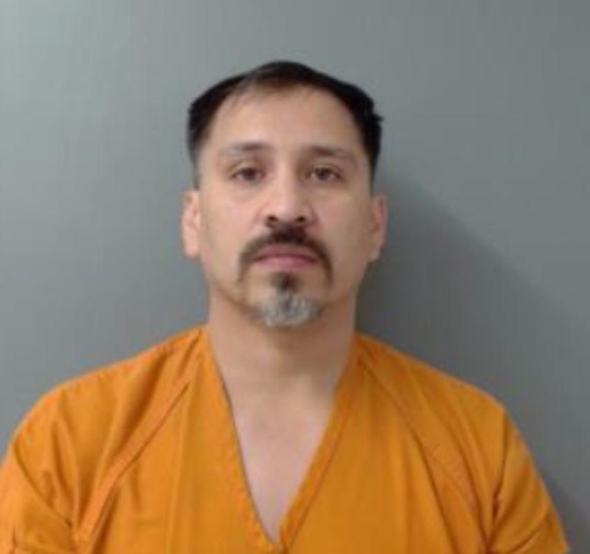A raid by Laredo authorities discovered firearms, narcotics, 24.6K
