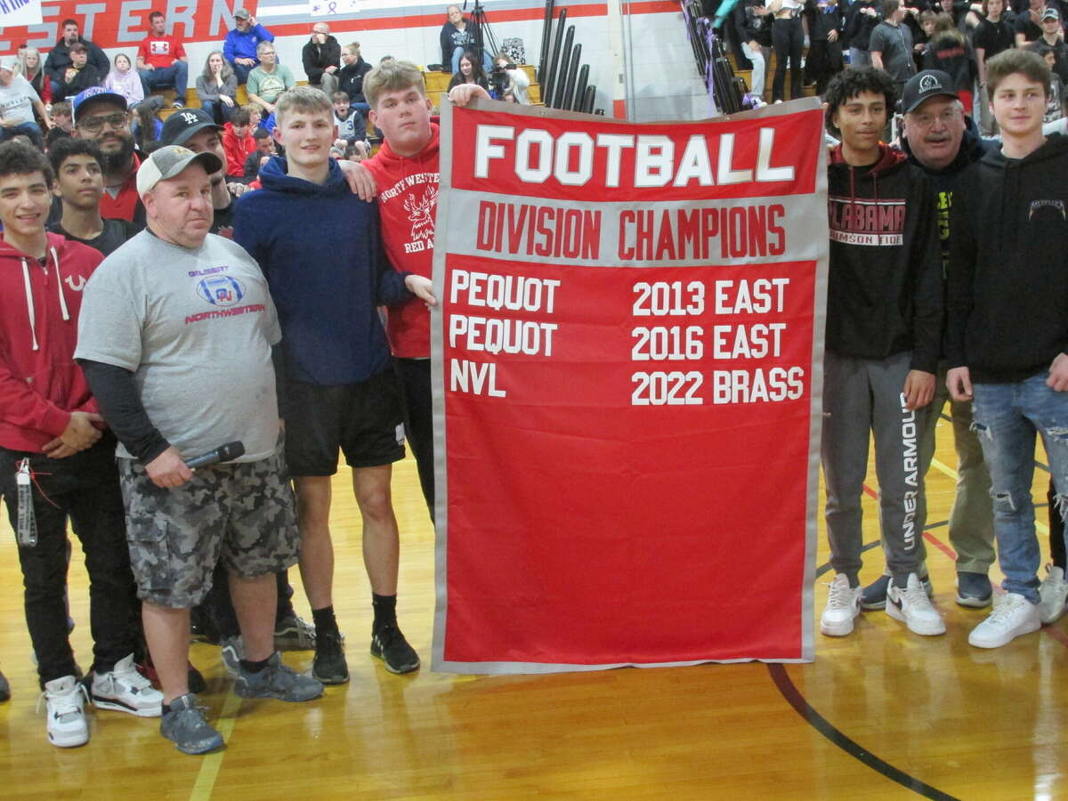 Team members from Northwestern and Gilbert celebrated their Gilbert/Northwestern/Housatonic NVL Brass Division football championship before their cross-town rivalry game Friday night at Northwestern High School.