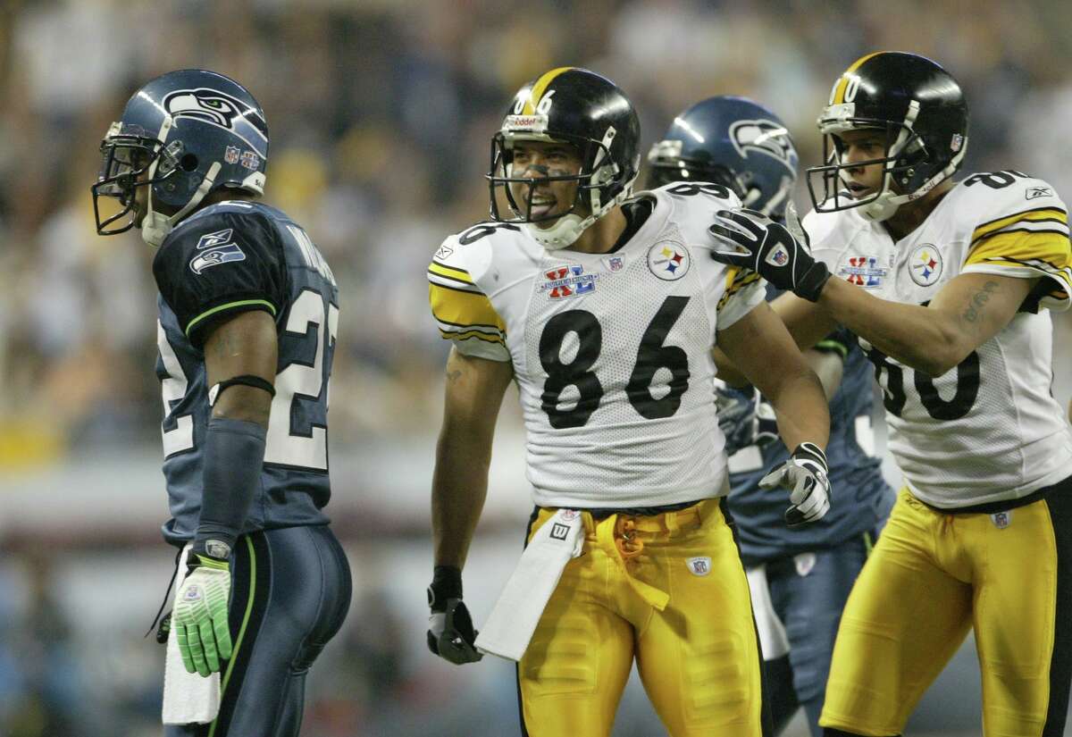 superbowl DELONG Pittsburgh Steeler Hines Ward taunts Jimmy Williams after a play on Sunday Feb. 5, 2006 in Detroit during the Super Bowl. Photo by Dan DeLong