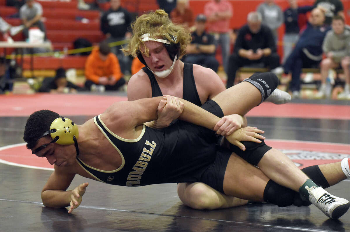 Ryan Gilchrist of Norwalk controls Warren Little of Trumbull in the 170-pound weight class final at the FCIAC wrestling tournament in New Canaan on Saturday, Feb. 11, 2023.