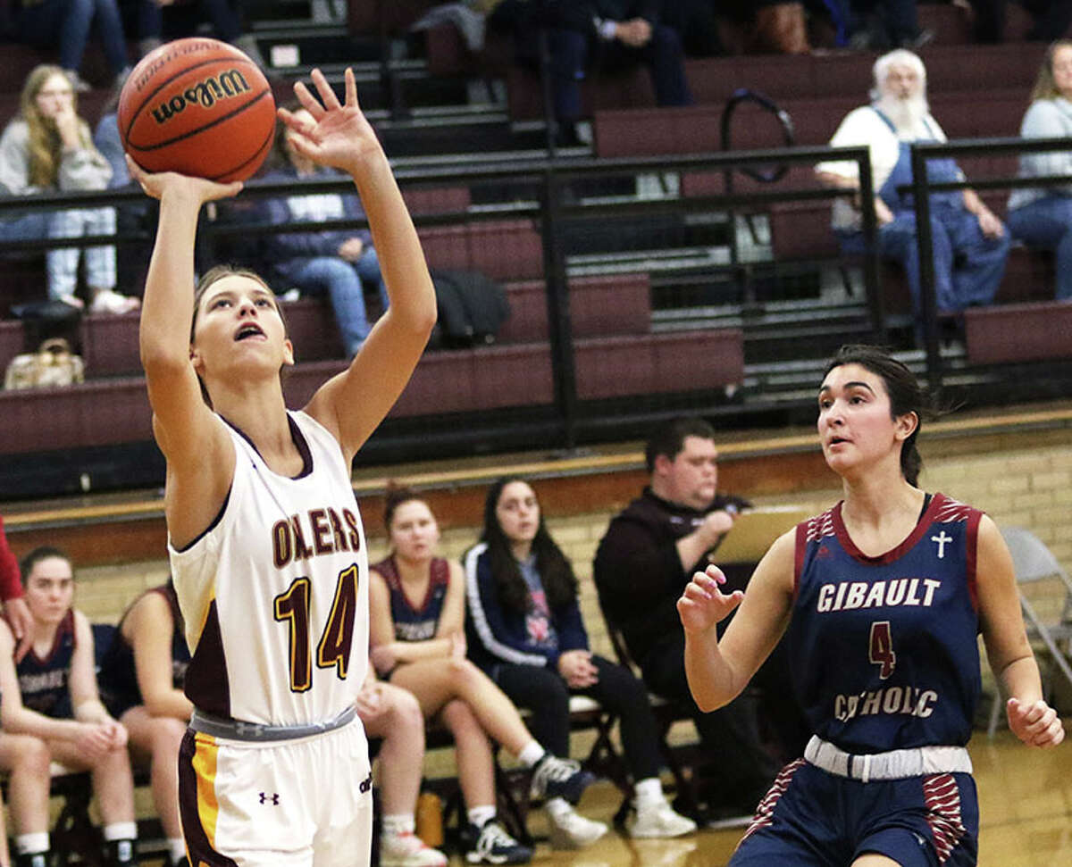 EA-WR freshman Kaylynn Buttry (left) puts up a shot after beating Waterloo Gibault's Bri Baldridge to the basket in a November game at the Dupo Tourney. On Saturday, Buttry scored 10 points in the Oilers' season-ending loss to Marquette.