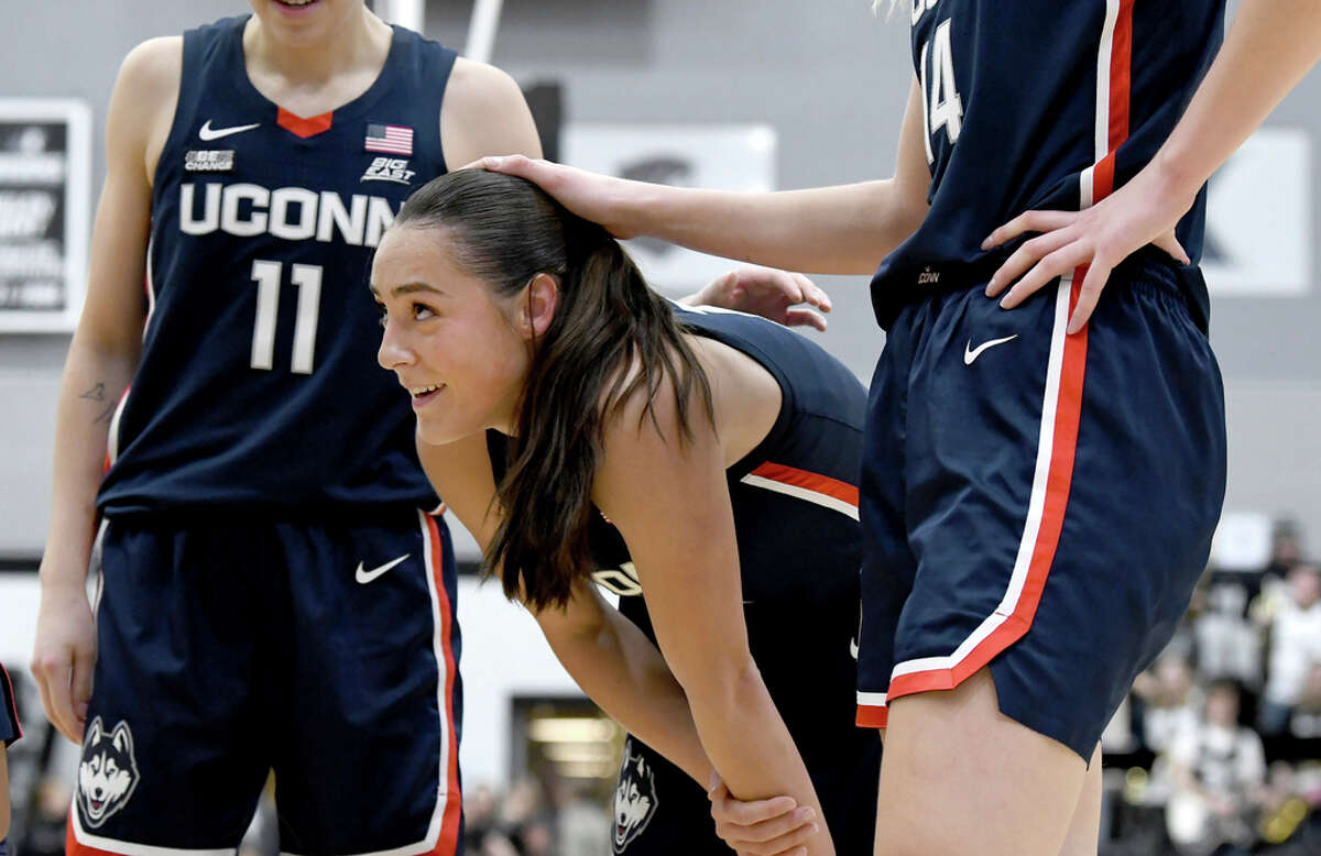 UConn's Nika MÃ¼hl takes a breather after falling to the court during the second half of an NCAA college basketball game against Providence, Wednesday, Feb. 1, 2023, in Providence, R.I. (AP Photo/Mark Stockwell)