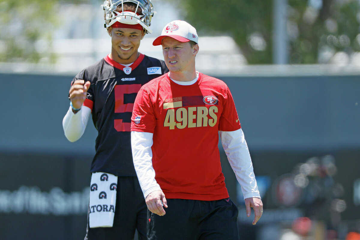 San Francisco 49ers quarterback Trey Lance (5) and offensive passing game coordinator Bobby Slowik at the 49ers Training Facility on Wednesday, June 1, 2022, in Santa Clara, Calif.