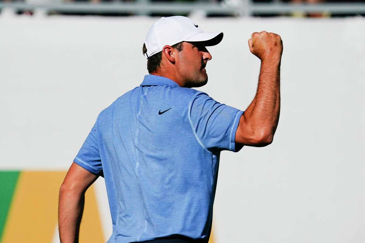 Scottie Scheffler pumps his fist after making par on the 16th hole of the final round of the Phoenix Open golf tournament, Sunday, Feb. 12, 2023, in Scottsdale, Ariz.