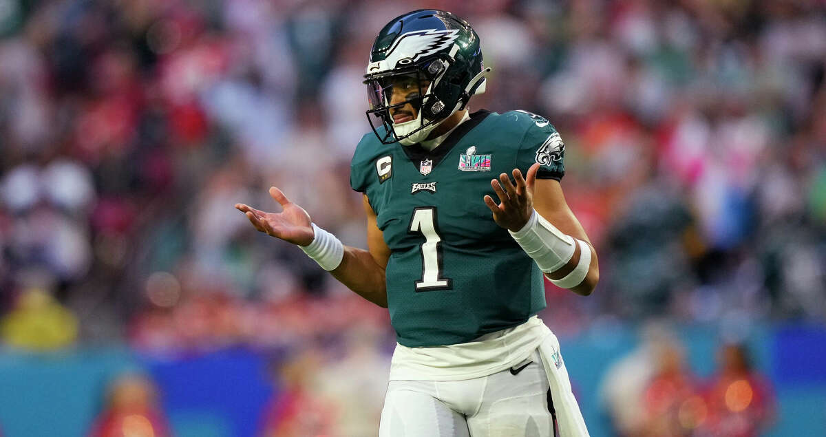 Philadelphia Eagles quarterback Jalen Hurts (1) gestures after his touchdown pass to wide receiver A.J. Brown (11) during the first half of the NFL Super Bowl 57 football game between the Kansas City Chiefs and the Philadelphia Eagles, Sunday, Feb. 12, 2023, in Glendale, Ariz. (AP Photo/Matt Slocum)