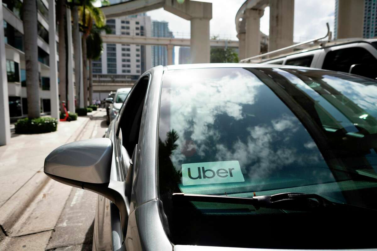 An Uber sticker is seen on a car windshield on the street in downtown Miami on Jan. 9, 2020. The San Francisco-based ride-hailing company received a mixed response for its latest Super Bowl ad.