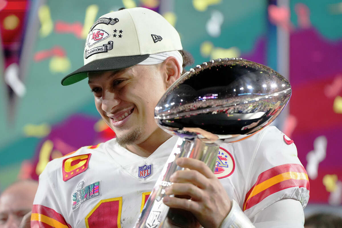 Kansas City Chiefs quarterback Patrick Mahomes (15) holds the trophy after their win against the Philadelphia Eagles in the NFL Super Bowl 57 football game, Sunday, Feb. 12, 2023, in Glendale, Ariz. The Kansas City Chiefs defeated the Philadelphia Eagles 38-35.