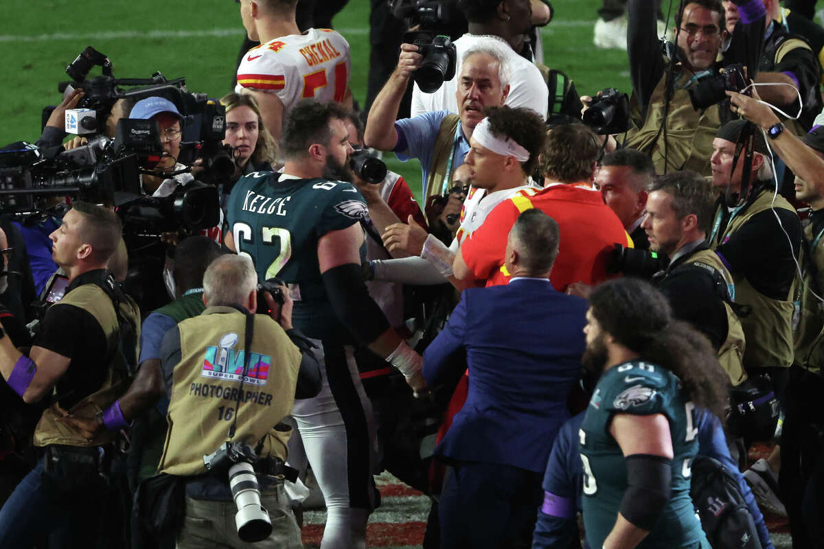 GLENDALE, ARIZONA - FEBRUARY 12: Jason Kelce #62 of the Philadelphia Eagles and Patrick Mahomes #15 of the Kansas City Chiefs meet on the field after Super Bowl LVII at State Farm Stadium on February 12, 2023 in Glendale, Arizona. (Photo by Sean M. Haffey/Getty Images)