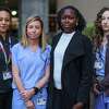 Charlene布莱克博士(唐森麻醉师的车diac surgeon Dr. Amy Fiedler, patient Fatou Gaye and perfusionist Ashley Risso, stand for a portrait outside UCSF Parnassus in San Francisco, Calif., on Tuesday, Feb. 7, 2023. In December, Dr. Amy Fiedler performed a 5-hour heart transplant on a 26-year old woman named Fatou Gaye. Only at the end did Fiedler realize there was not a man in the room. All 8 on the surgical team were women. UCSF thinks this is a first in 150 years at UCSF if not a first anywhere because surgical teams are selected at random and there are very few female heart transplant surgeons