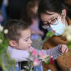 Angela Winbisch, 4, and her mother Reka Winbisch, of Greenwich, create a flower crown together at the Val-Gal-Palentine's Day Flower Crown Workshop at Greenwich Botanical Center in the Cos Cob section of Greenwich, Conn. Sunday, Feb. 12, 2023. Workshop attendees learned how to assemble a colorful crown made from locally-sourced flowers and ornamental grasses.
