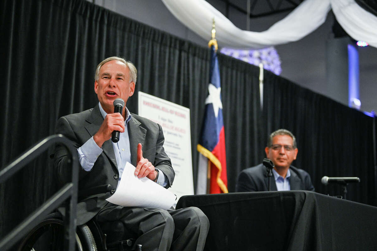 Texas Governor Greg Abbott, left, speaks about his Parental Bill of Rights as Rep. John Lujan sits by him at the PicaPica Plaza Event Center on the Southside of San Antonio on Monday, May 9, 2022. 