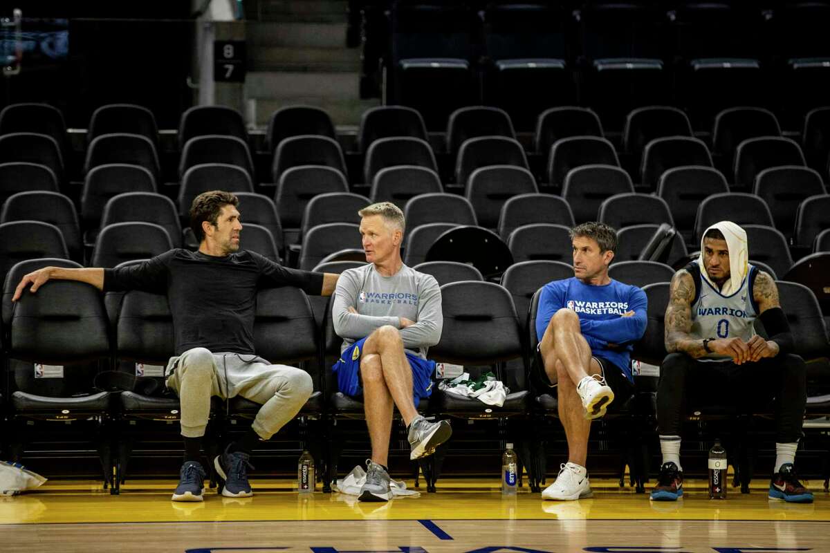 (L-R) Golden State Warriors General Manager Bob Myers, Head Coach Steve Kerr, Director of Sports Medicine & Performance Rick Celebrini, and guard Gary Payton II are seen during NBA Finals Practice and Media Availability at Chase Center in San Francisco, Calif. Wednesday, June 1, 2022.