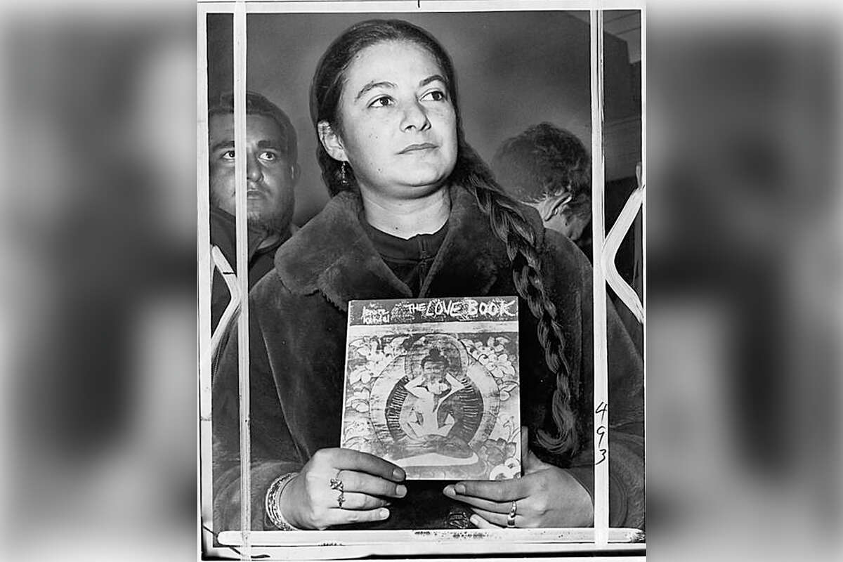 Lenore Kandel holds a copy of "The Love Book."