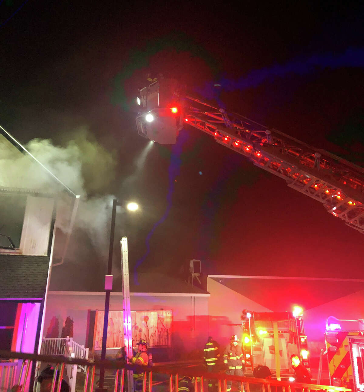A fire heavily damaged a historic house that served as Madison's original post office, owned by the neighboring E.C. Scranton Memorial Library, Monday evening, according to officials.