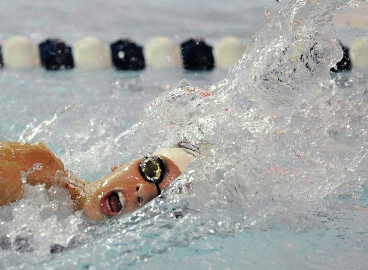 Jesse Evans of the Greenwich High School girls swim team competes in the 200 meter freestyle event against New Canaan High School at the YMCA of New Canaan, Wednesday afternooon, Oct. 13, 2010.