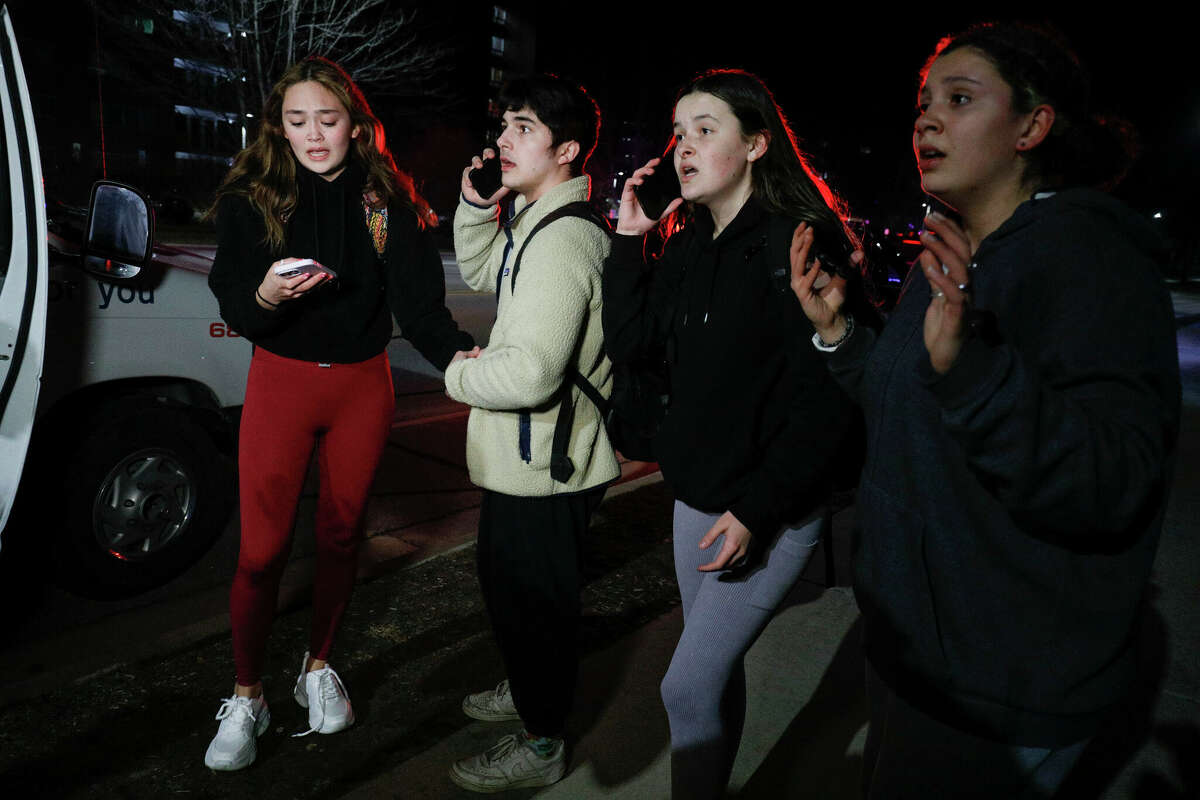 LANSING, MI - FEBRUARY 13: Michigan State University students react during an active shooter situation on campus on February 13, 2023 in Lansing, Michigan. Five people were shot and the gunman still at large following the attack, according to published reports. The reports say some of the victims have life-threatening injuries. (Photo by Bill Pugliano/Getty Images)