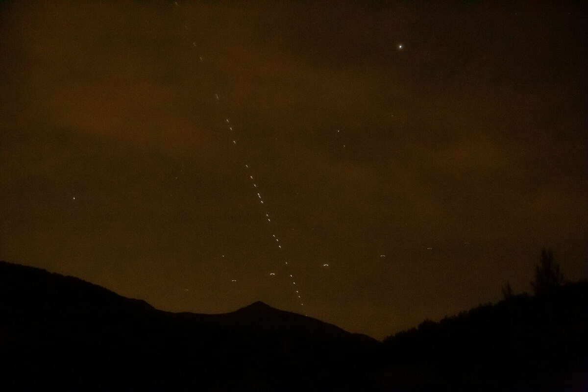 A view of lined up beams of light of the Starlink satellites spotted in sky over Hatay, Turkey on May 08, 2021.