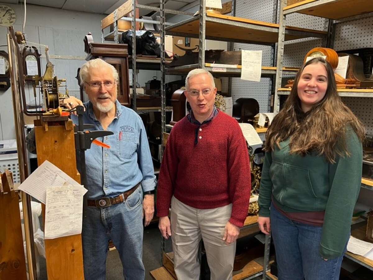 Stuart McGeary, 83, left, master clocksmith at Waterford Clock Co., with apprentices Richard Cohen and Rose Levi. 