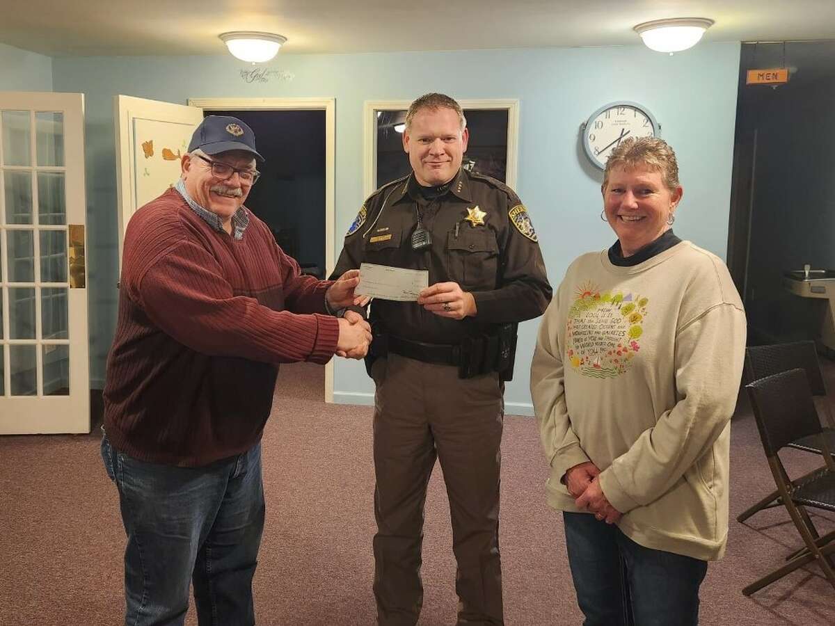 Lake County Sheriff Rich Martin (center) presented members of Edgetts Wesleyan Church in Luther with a check for $1,000 to support the food pantry, part of the ongoing LCSO Charitable Campaign.