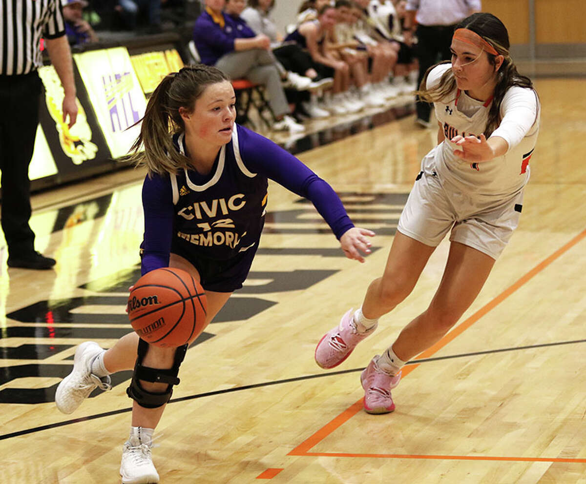 CM's Aubree Wallace (left) drives on Waterloo's Sam Lindhorst in a MVC girls basketball game in December at Waterloo. The teams met again Monday night, with Waterloo again winning and ending CM's season in the Highland Class 3A Regional.