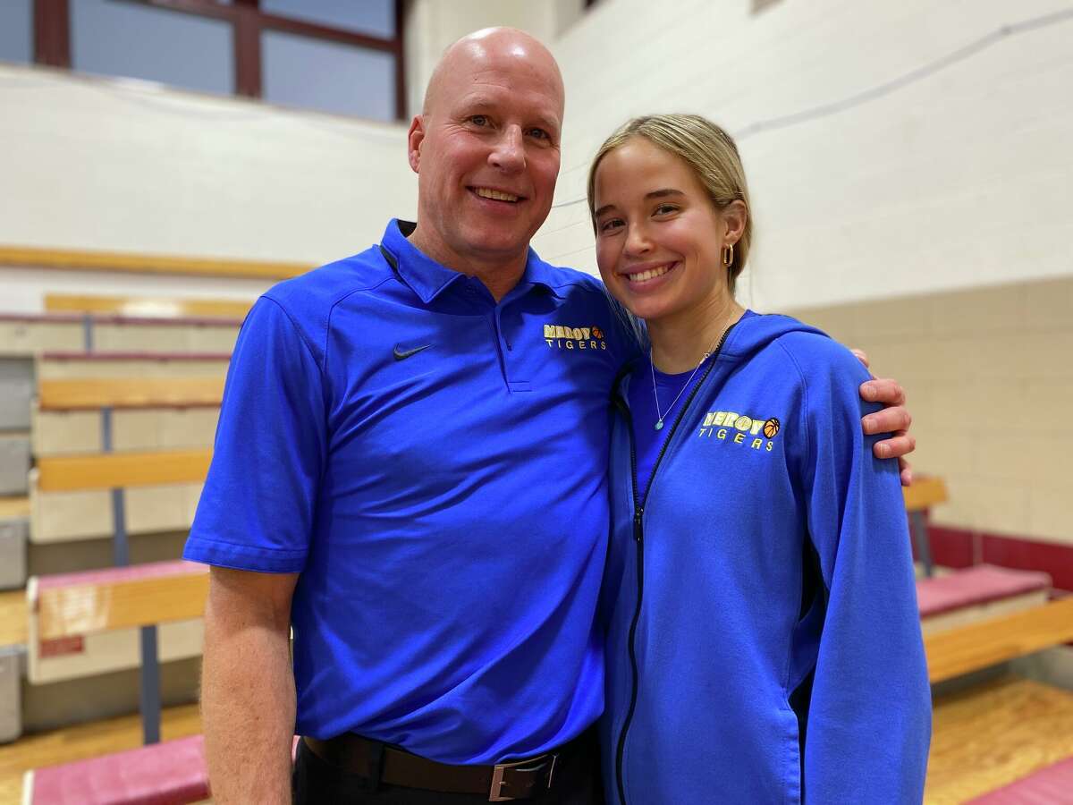 Mercy girls basketball coach Tim Kohs with his duaghter Avery who is a senior on the Mercy team.