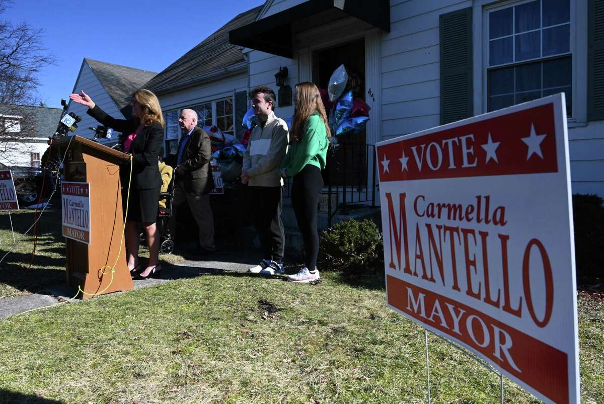 Troy Council President Carmella Mantello is joined by family members as she announces her bid for mayor of Troy as the Republican challenger on Tuesday, Feb. 14, 2023, outside her home in Troy, N.Y.