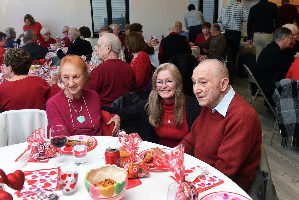 West Haven Mayor Nancy Rossi, center, talks with Robin and Gabe Alvandian during a Valentine's Day party for couples married 50 years or more at the West Haven Senior Center Tuesday. The Alvandians have been married for 65 years.