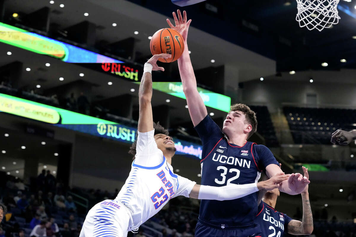 Connecticut's Donovan Clingan (32) blocks the shot of DePaul's Caleb Murphy during the second half of an NCAA college basketball game Tuesday, Jan. 31, 2023, in Chicago. UConn won 90-76. (AP Photo/Charles Rex Arbogast)