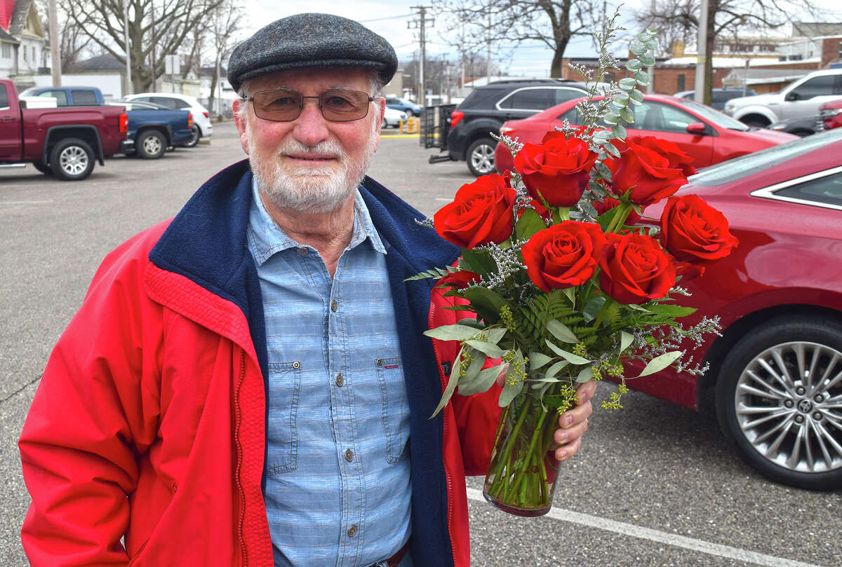 Robert McBride of Jacksonville was one of many picking up gifts on Valentine's Day for their special someone: in his case, a bouquet of roses for his wife of 28 years, Ellen. McBride said his wife was "the best thing that's ever happened to me" and he likes "absolutely everything" about her.