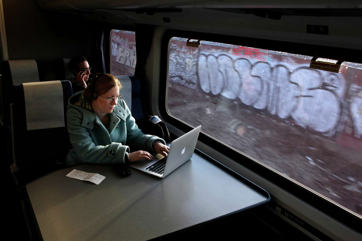 Amber Sass of Sacramento uses her laptop while on the Capitol Corridor Amtrak Train.