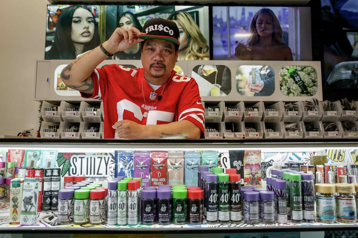 Rudy Corpuz, shown behind the counter at STIIIZY SoMa in San Francisco, opened the first Filipino-owned dispensary in the city’s Filipino Cultural Heritage District as a part of the its cannabis equity program.