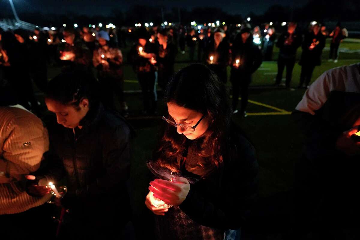 Lexi Bailey attends a candlelight vigil for Alexandria Verner at the Clawson High School football field in Clawson, Mich., Tuesday, Feb. 14, 2023. Verner was among the students killed after a gunman opened fire on the campus of Michigan State University Monday night.
