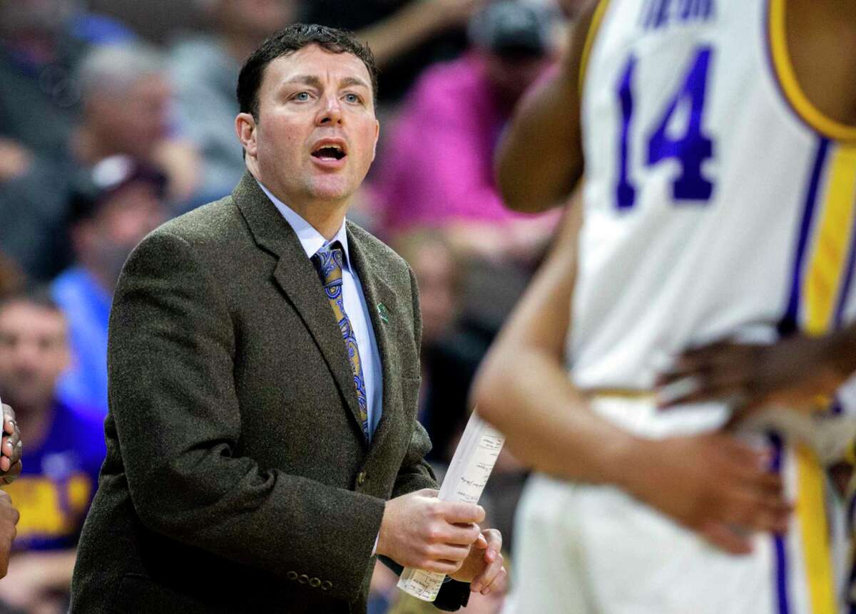 FILE - Then-LSU assistant coach Greg Heiar, center, shouts from the sideline during the team's NCAA men's college basketball tournament game against Yale in Jacksonville, Fla., March 21, 2019. New Mexico State suspended operations of its men's basketball program indefinitely Friday night, Feb. 10, 2023, and placed its coaching staff, including Heiar, on paid administrative leave. ( AP Photo/Stephen B. Morton, File)