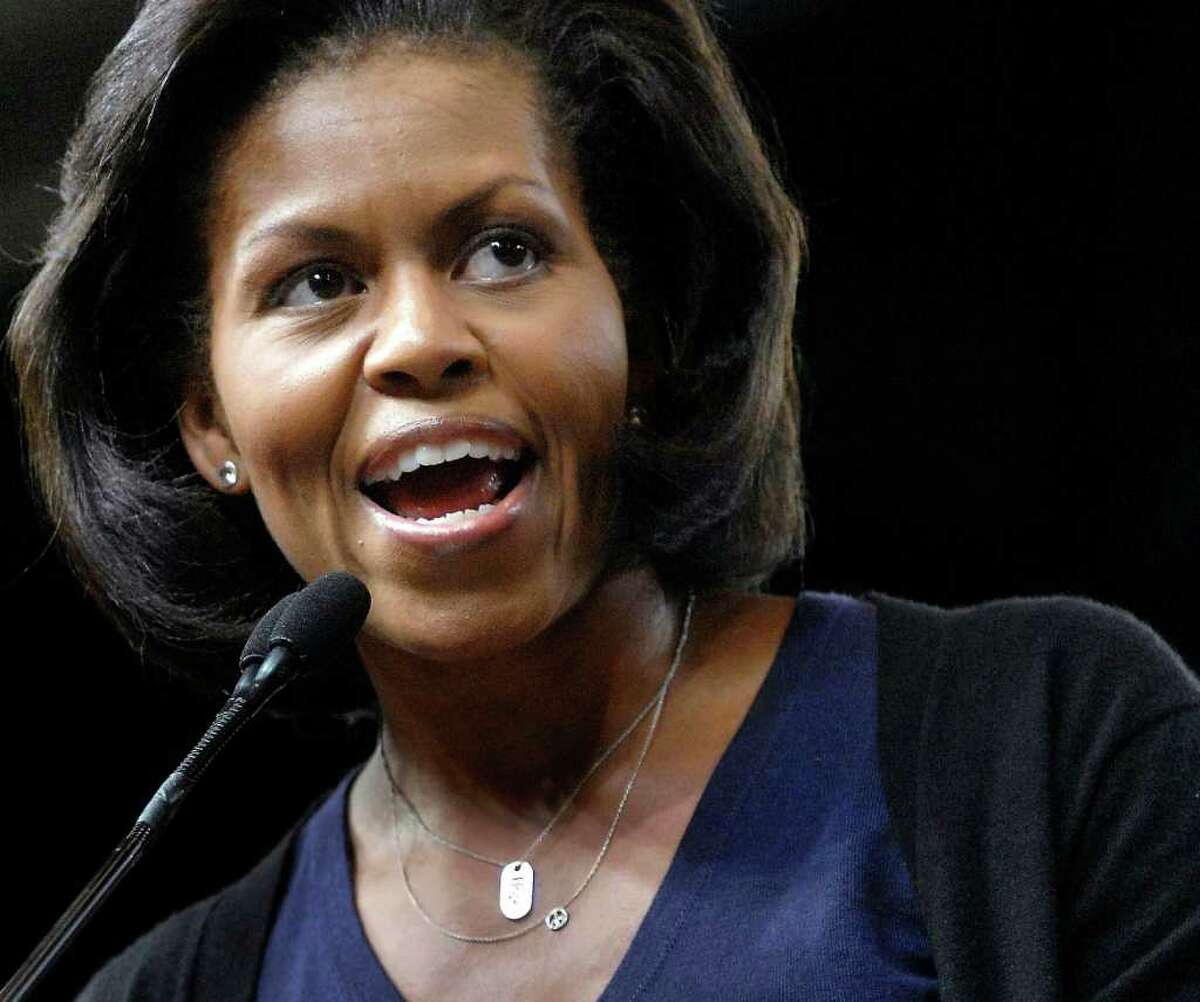 In this Oct. 13, 2008, file photo Michelle Obama, wife of Democratic presidential candidate Sen. Barack Obama, D-Ill., speaks to supporters during a rally at Macalester College in St. Paul, Minn. Not seen on the stump since the 2008 campaign that elevated her husband to the White House, Mrs. Obama is venturing out this week to support a group of candidates, mostly senators, whose help President Barack Obama needs to keep advancing his agenda through Congress in the two years left in his term. On Monday, she's scheduled to appear at Stamford's Palace Theatre for a fundraiser for Senate candidate Richard Blumenthal. (AP/Photo Craig Lassig, File)