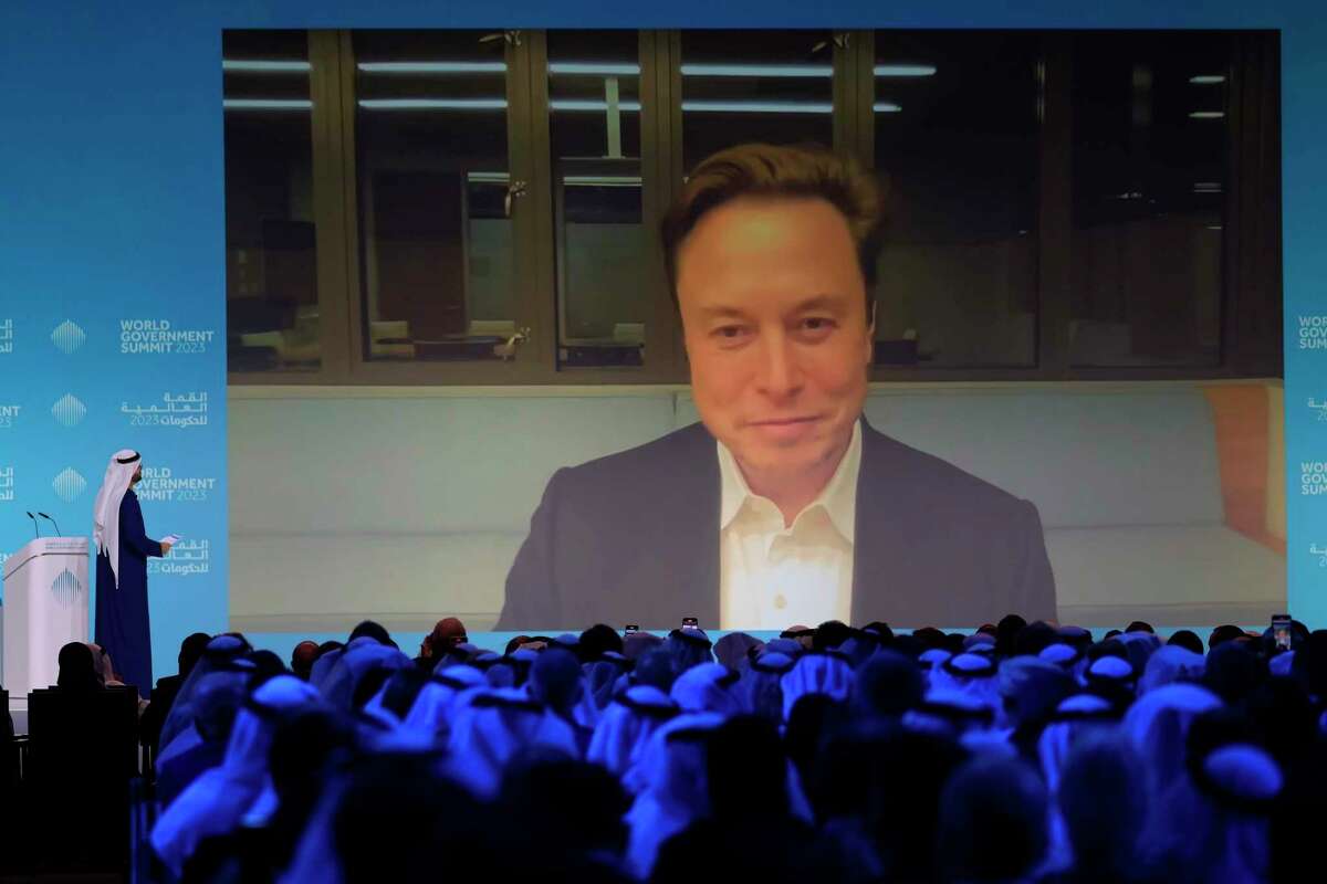Elon Musk talks virtually to UAE Minister of Cabinet Affairs Mohammad Al Gergawi during the World Government Summit in Dubai, United Arab Emirates, Wednesday, Feb. 15, 2023.