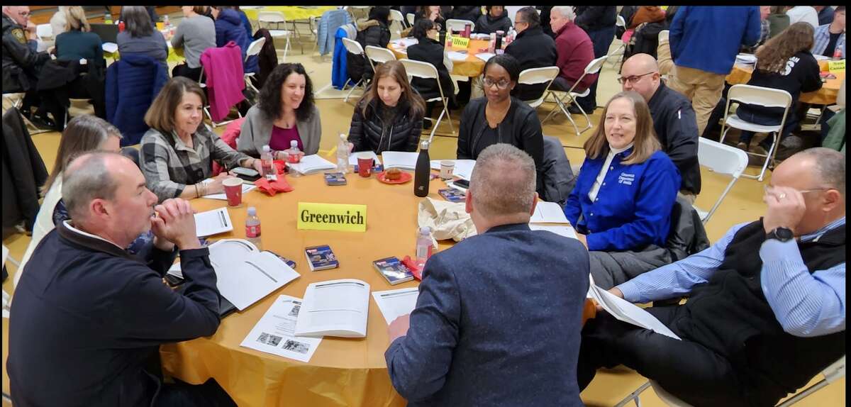 Representatives from Greenwich emergency-service and social-service agencies take part in a "tabletop" simulation with other first-responders from around the region.