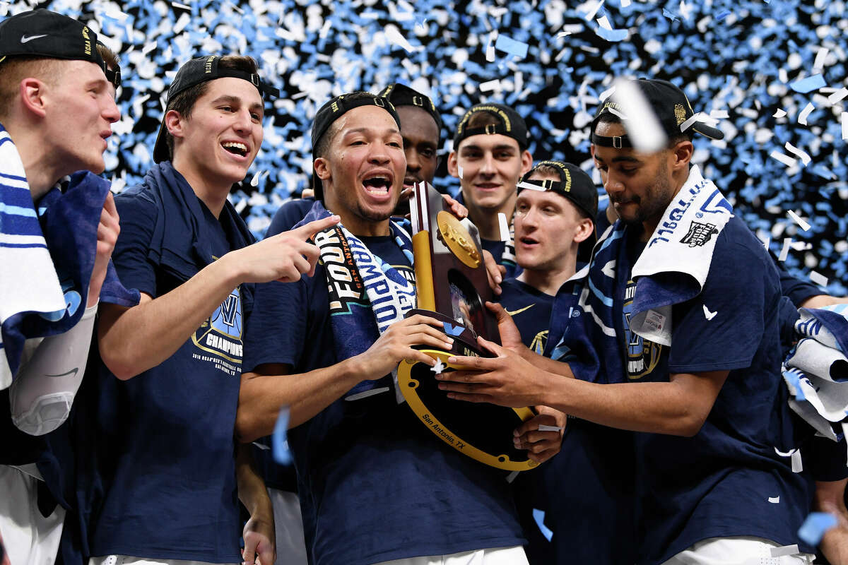 Jalen Brunson #1 of the Villanova Wildcats celebrates with the trophy after the 2018 NCAA Photos via Getty Images Men's Final Four National Championship game against the Michigan Wolverines at the Alamodome on April 2, 2018 in San Antonio, Texas.
