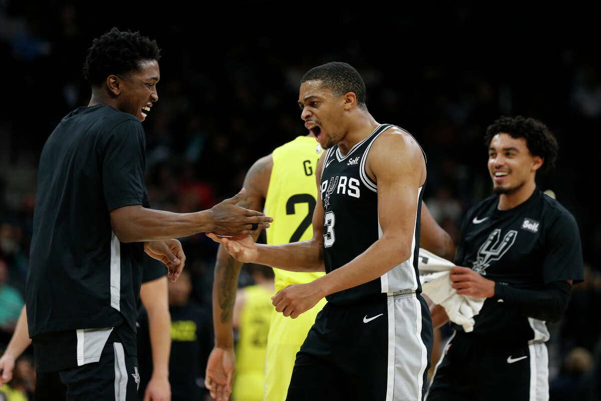 Keldon Johnson #3 of the San Antonio Spurs celebrates with teammates after a basket against the Utah Jazz in the second half at AT&T Center on December 26, 2022 in San Antonio, Texas.
