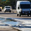 A puddle of water and ice on North Shepherd remain from a broken water main as temperatures remain below freezing on Friday, Dec. 23, 2022 in Houston. An incoming cold front could drop the mercury below freezing for parts of the Houston area later this week. 