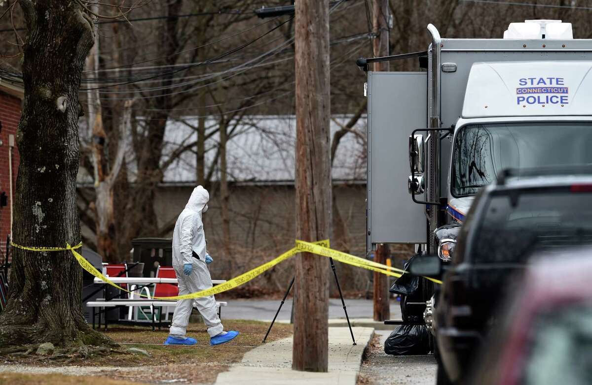 Connecticut State Police investigate a scene on Middle Street in Brooklyn, Connecticut, on February 15, 2023 where three people were found dead.