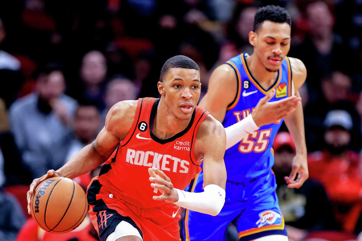 Jabari Smith Jr. #1 of the Houston Rockets controls the ball ahead of Darius Bazley #55 of the Oklahoma City Thunder during the first half at Toyota Center on February 01, 2023 in Houston.
