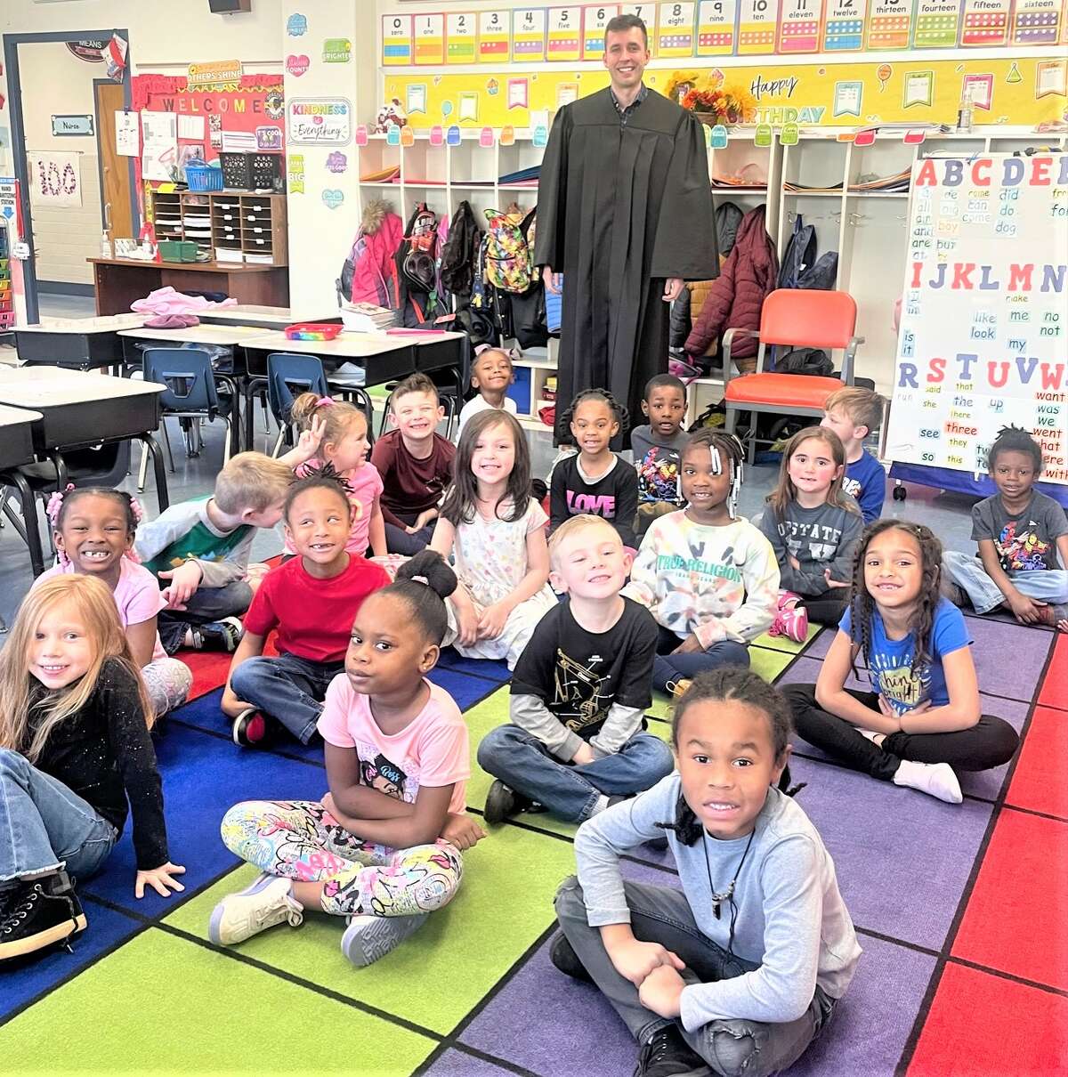 Associate Judge Justin Zimmerman participated in “Judges Go to School Day” Monday. Three judges from the 3rd Circuit went to Lovejoy, Eunice Smith and Lewis & Clark elementary schools in the Alton School District and read to young students. The program is a project of the Illinois Judges Association aimed at children in grades K – 4 to encourage the appreciation, value and enjoyment of reading.
