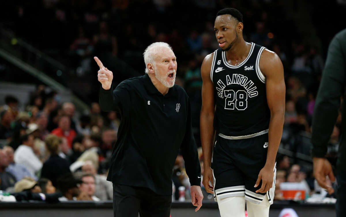Head Coach Gregg Popovich talks with Charles Bassey #28 of the San Antonio Spurs in the second half at AT&T Center on December 12, 2022 in San Antonio, Texas. 